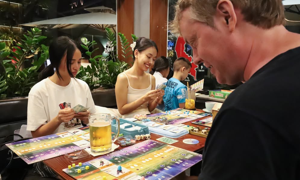 Guests playing board games over a pint of craft beer at E-Space Coffee & Craft Beer