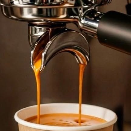 Fresh espresso pouring from the portafilter