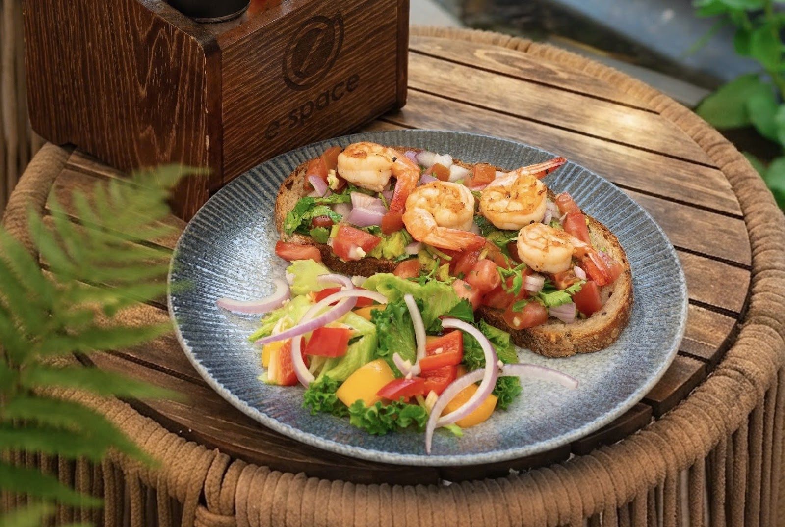 Shrimp avocado toast on sourdough with a fresh side salad at E-Space Coffee & Craft Beer